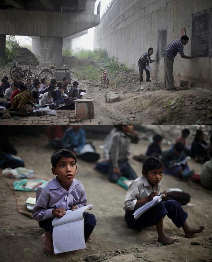 Indian children learning in a impromptu school under a bridge